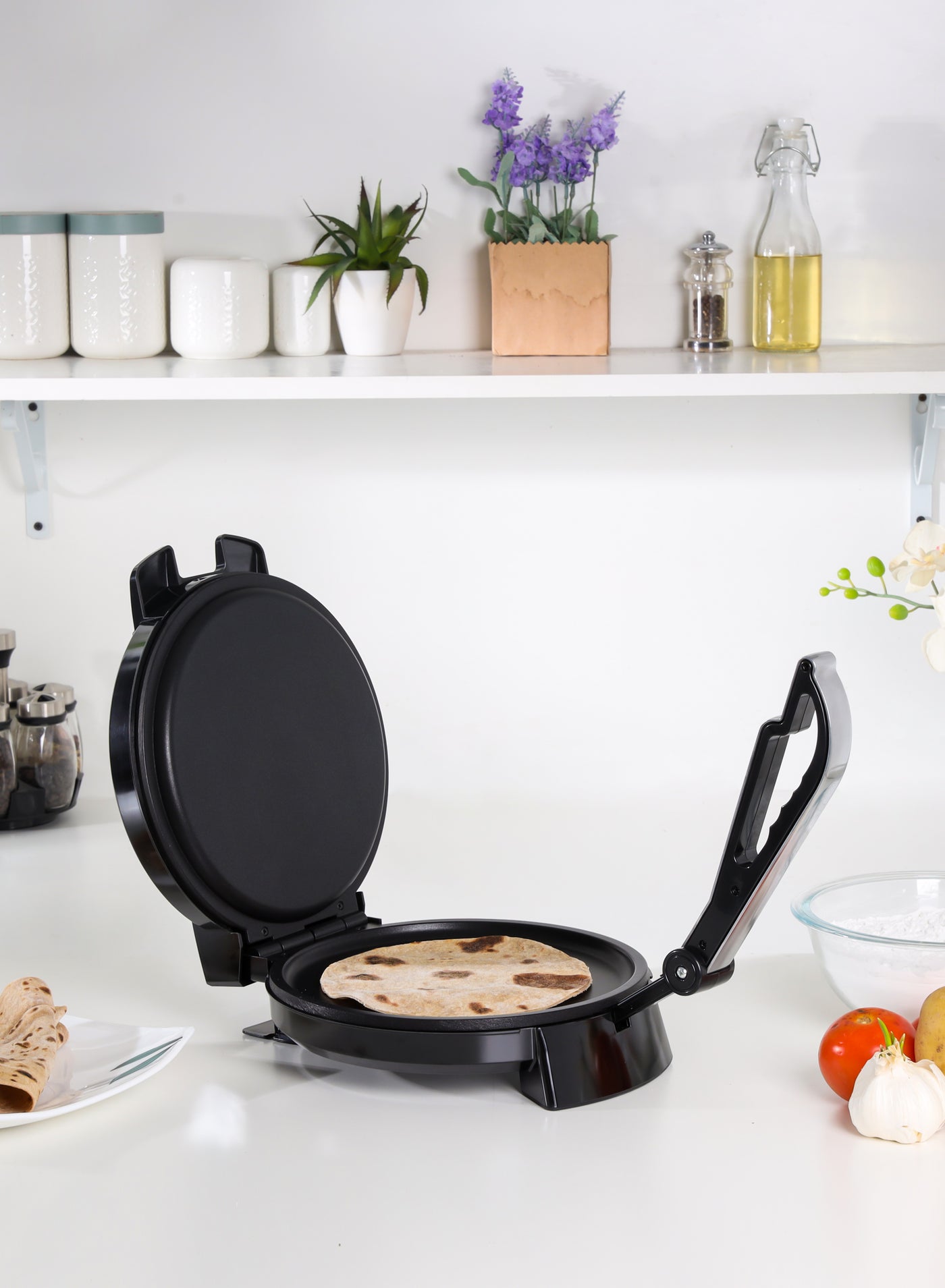 Compare 10 Chapathi Maker With NonStick Plates For Easy Food Release Mechanism And Easy Cleaning, Adjustable Temperature| Strong And Sturdy Construction With An AntiSkid Base| Easy Round Chapathi, Papad, Roti And Puri Maker With Handle 1200 W GCM6125N black at KSA Price